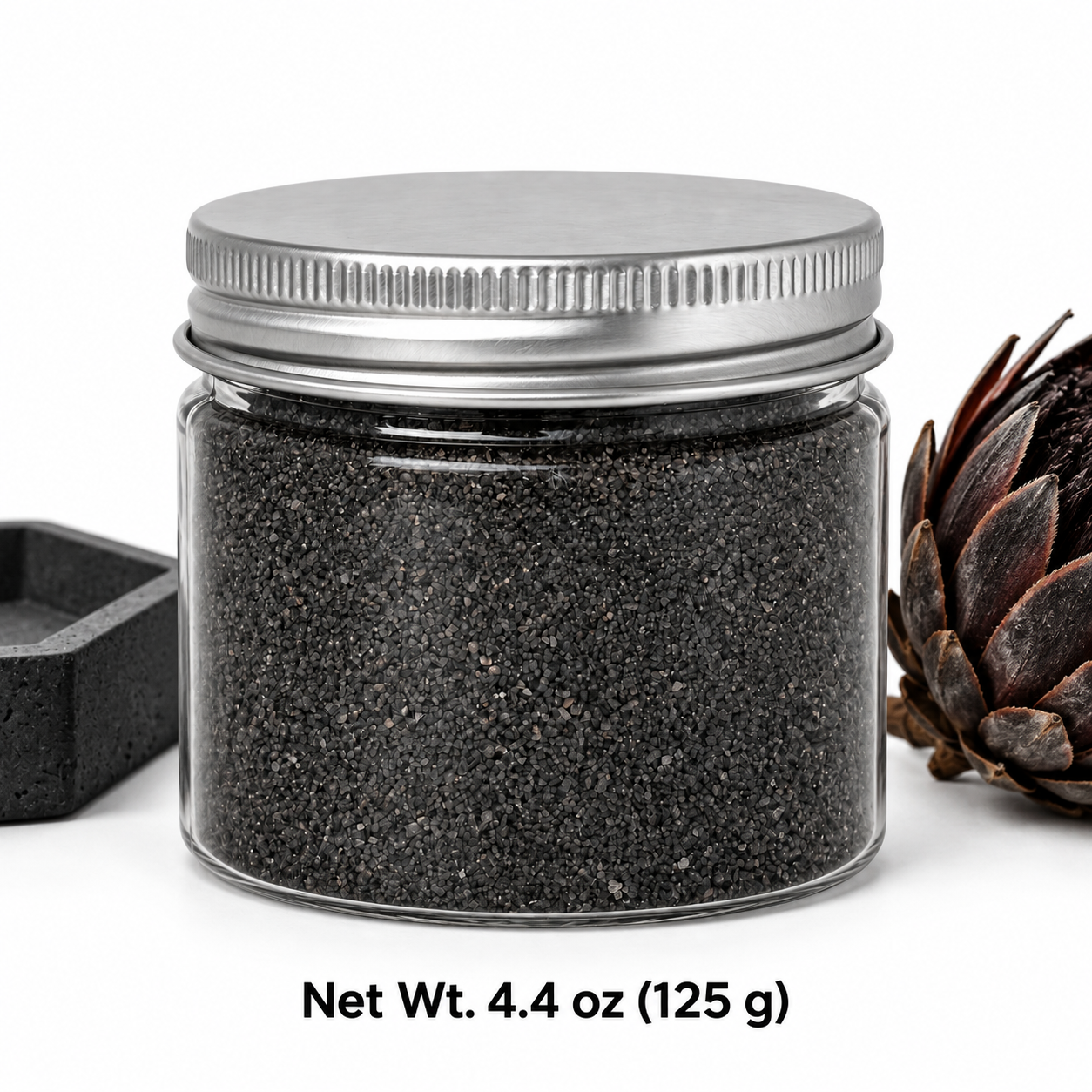 Clear jar of Volcanic Ash quartz sand